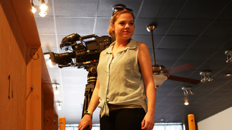 Student videographer on the set of Show-Me Chefs.