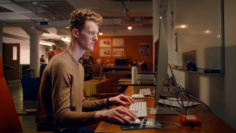 Student using computer.